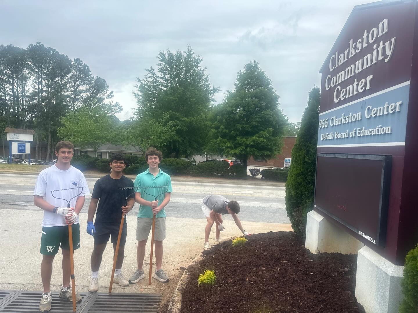 Volunteers restoring the garden and community space outside Clarkston Community Center